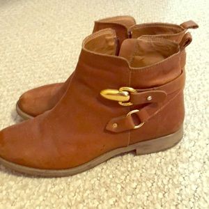 Flat brown leather boots